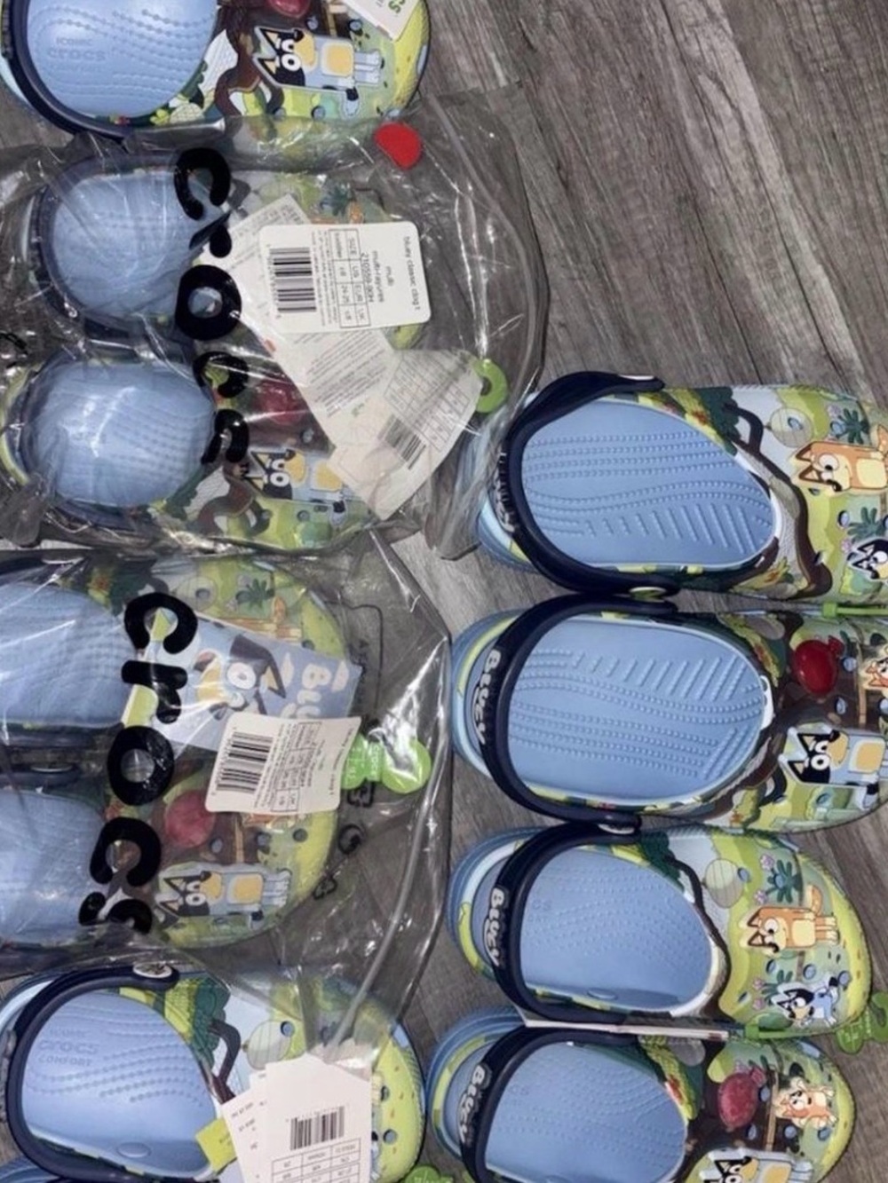 CROCS Kids Cartoon Clogs in Light Blue and Lime Green